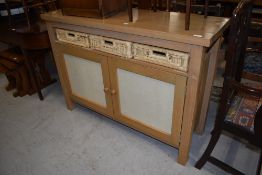 A modern satin wood side board having woven drawer set with under cupboard H85cm x W120cm x D40cm