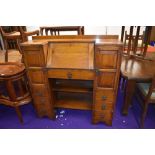 A 1930s oak bureau with side by side cupboards and book shelf under, nice proportions, width approx.