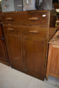 An oak tall boy style cupboard having double top drawer set H122cm x W84cm x D47cm