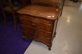 A vintage mahogany three drawer bedside table with lift flap top, width approx. 54cm