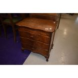 A vintage mahogany three drawer bedside table with lift flap top, width approx. 54cm