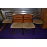 A vintage G plan or similar teak gateleg table and four rail back chairs, chairs labelled as G plan,