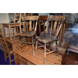 Two traditional solid seat kitchen chairs