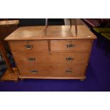 A Victorian stripped pine chest of two over two drawers having brass drop handles, dimensions