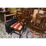 A pair of hard wood framed carver chairs having striped upholstery