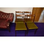 A set of four reproduction Regency rail back dining chairs having inlay to top rails, dralon seats