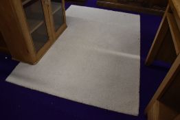 A modern cream rug, approx. 204 x 139cm
