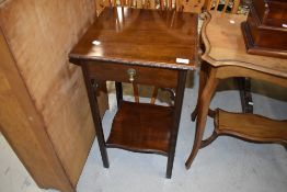 An early 20th Century telephone or side table with drawer on fluted legs in oak W40cm x H72cm x 40cm