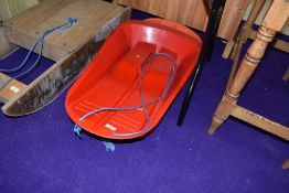 Two plastic sledges