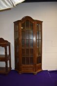 An early to mid 20th Century oak display cabinet, having glazed centre and side panels, single