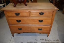A late Victorian light satin wood chest of two over two drawers H81cm x W107cm x D48cm