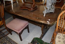 A vintage dark stained Ercol dining table, length approx. 183cm