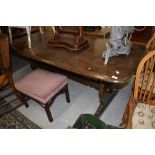 A vintage dark stained Ercol dining table, length approx. 183cm