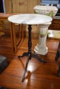 A small wine or side table with marble top