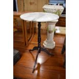 A small wine or side table with marble top