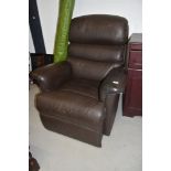 A brown leather style easy chair recliner