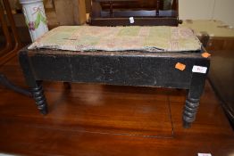 A dark stained Victorian double foot stool having bobbin turned legs