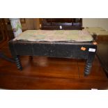 A dark stained Victorian double foot stool having bobbin turned legs