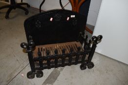 A traditional cast fire grate approx. 56 x 28cm