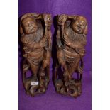 A pair of mirrored hand carved wooden figures of two Chinese fisherman catching Carp approx 30cm