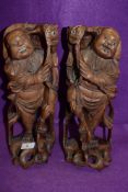 A pair of mirrored hand carved wooden figures of two Chinese fisherman catching Carp approx 30cm