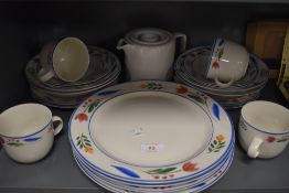 A selection of table and kitchen wares including Tienshan Stoneware mugs plates and bowls