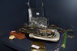 A selection of ladies dress items including hand and clutch bags and compact