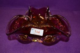 An art glass bowl heavy set with splash design having yellow to cranberry colour way