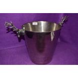 A large ice or champagne bucket having twin stag head handles