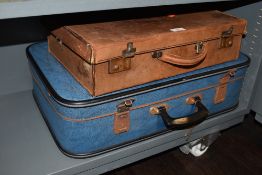 Two vintage travel trunks one leather bound suitcase and later teal blue 70's