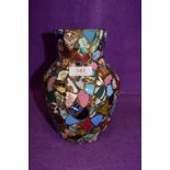 A studio pottery mosaic style vase