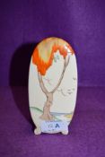 An art deco sugar sifter or similar by Clarice Cliff hand decorated with tree and landsacpe