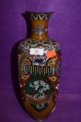 An oriental cloisonne vase having pheonic and dragon decoration having one side badly damaged