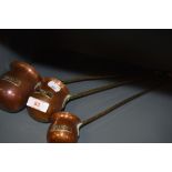 A set of graduated spirit ladle including Whiskey Brandy and Rum