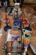 A selection of cocktail and party items including cocktail shaker and martini glasses