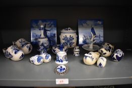 A selection of blue and white wear ceramics in Dutch delft designs including tiles