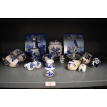 A selection of blue and white wear ceramics in Dutch delft designs including tiles