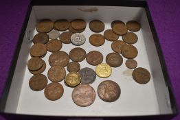 A mixed collection of vintage and antique coins, including Britain, Guernsey, Canada and similar.