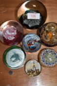 A selection of glass art paper weights including CG and Caithness Cauldron