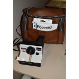 A vintage Polaroid land camera 1000 with red button, Polaroid case , warranty voucher for SX-70 film