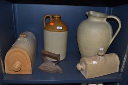 A selection of earthen ware jugs and bed warmers also cast stove iron