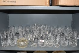 A selection of clear cut and crystal spirit and wine glasses including named brands