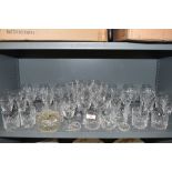 A selection of clear cut and crystal spirit and wine glasses including named brands