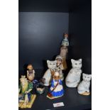 A selection of ceramic figures and studies including Chinese mudman Royal Doulton Mrs Bunnykins