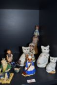 A selection of ceramic figures and studies including Chinese mudman Royal Doulton Mrs Bunnykins