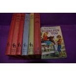 A selection of Enid Blyton books including Brer rabbit and Rascal.