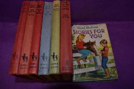 A selection of Enid Blyton books including Brer rabbit and Rascal.