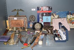 A selection of curios and collectables including letter openers and pen selection including