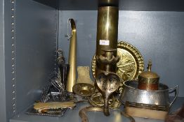 A selection of metal and plated wares including military shell dated 1947 also horse brasses and