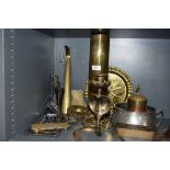 A selection of metal and plated wares including military shell dated 1947 also horse brasses and